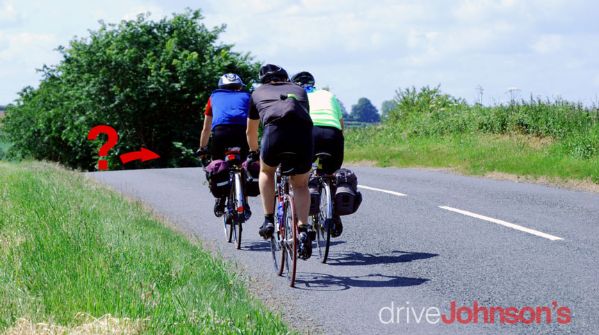 Cyclists approaching a hill