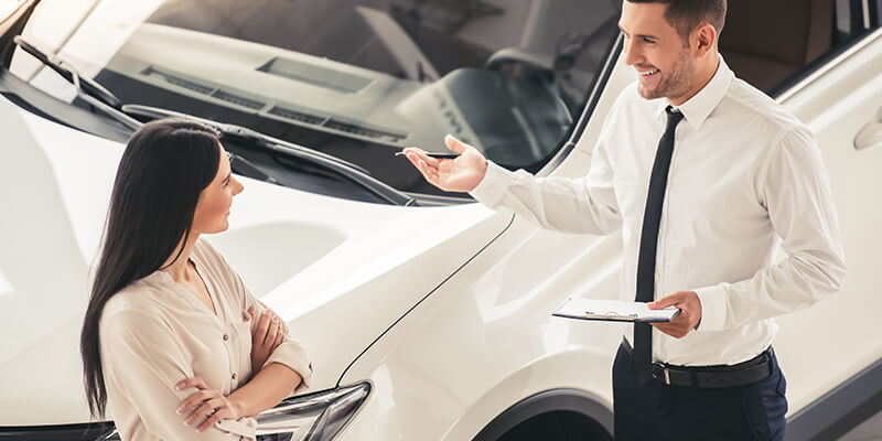 Woman At Car Dealership