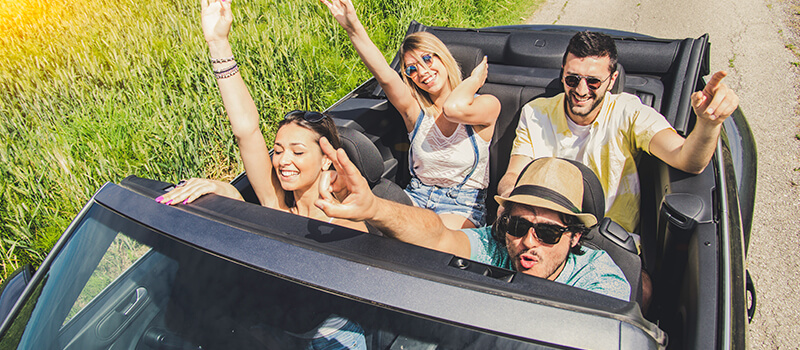 group of friends in car