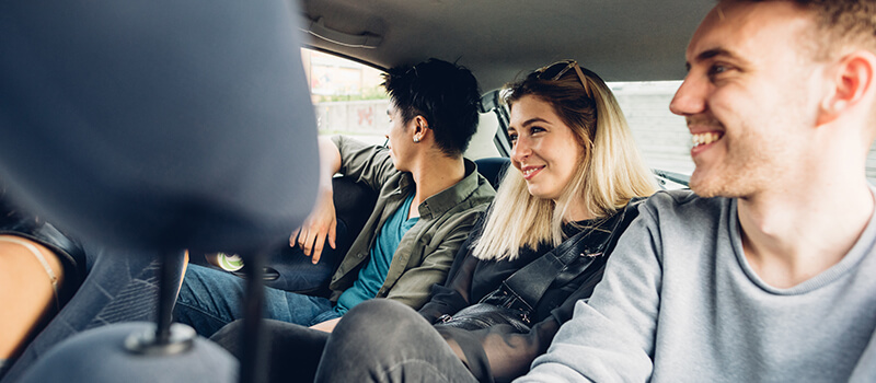 group of young people in car