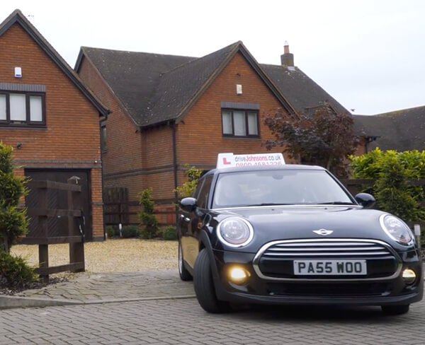 Mini pulling off driveway