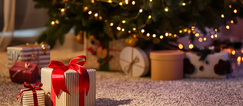 christmas presents next to tree