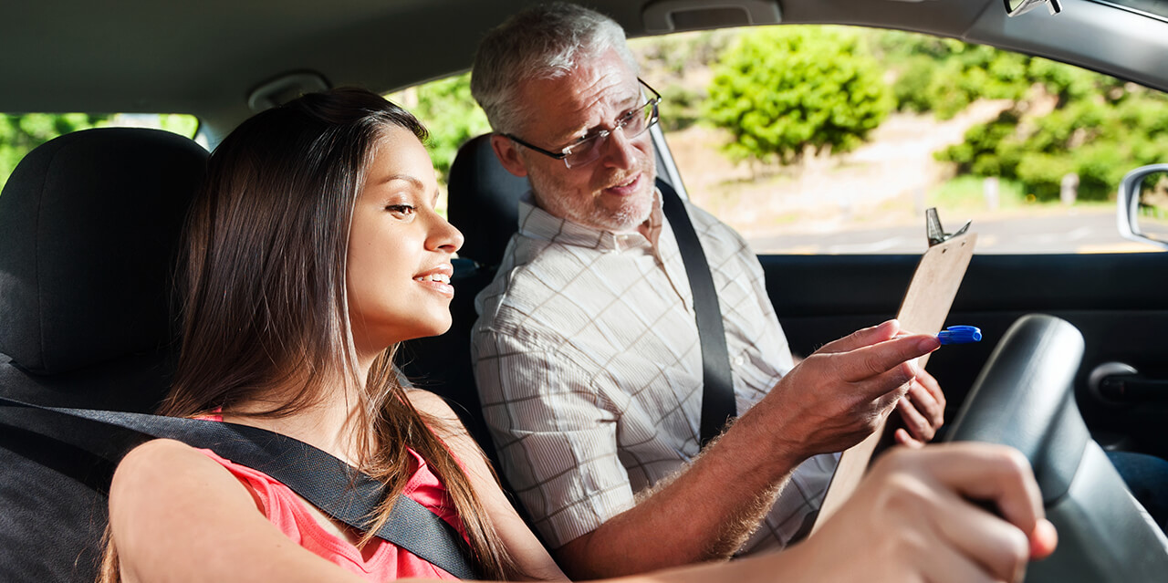 Learner listening to driving examiner