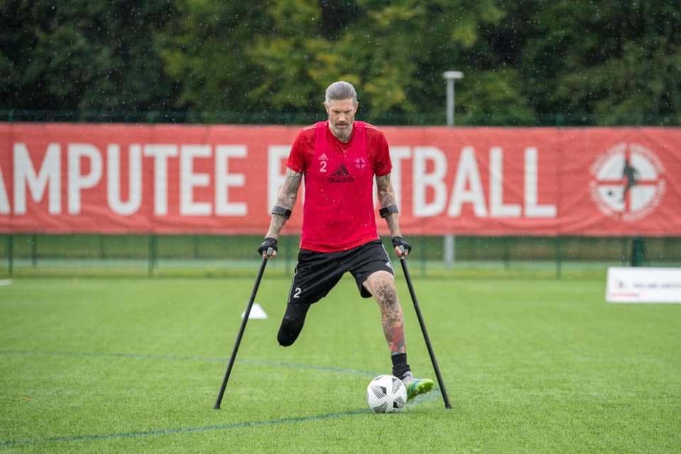 Tony Mills playing football