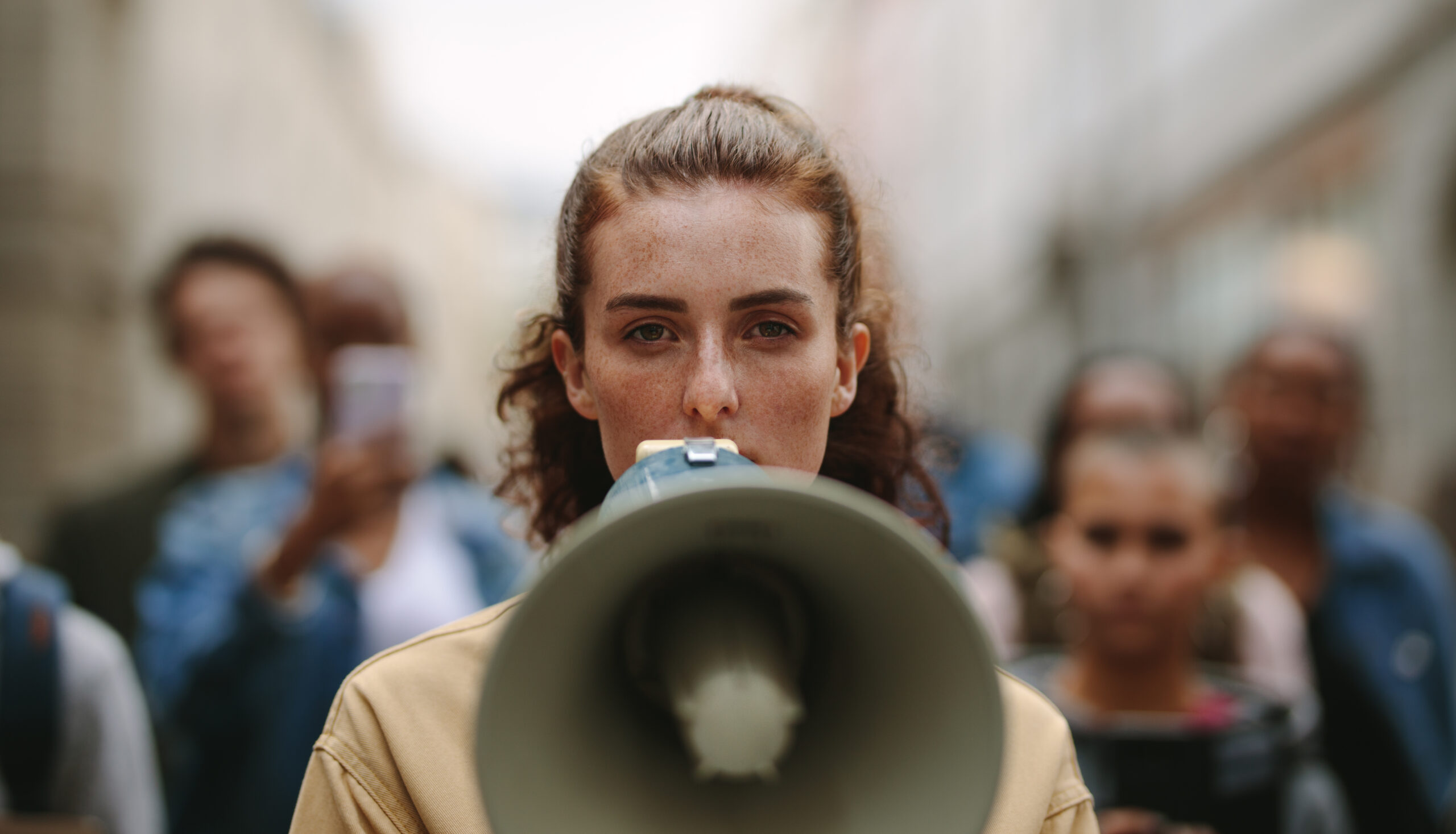 woman string and holding a megaphone