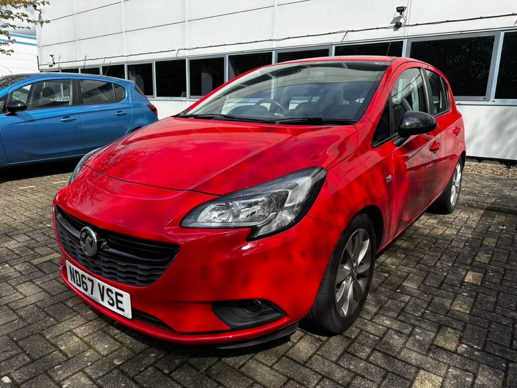 Front view of red Vauxhall Corsa for hire