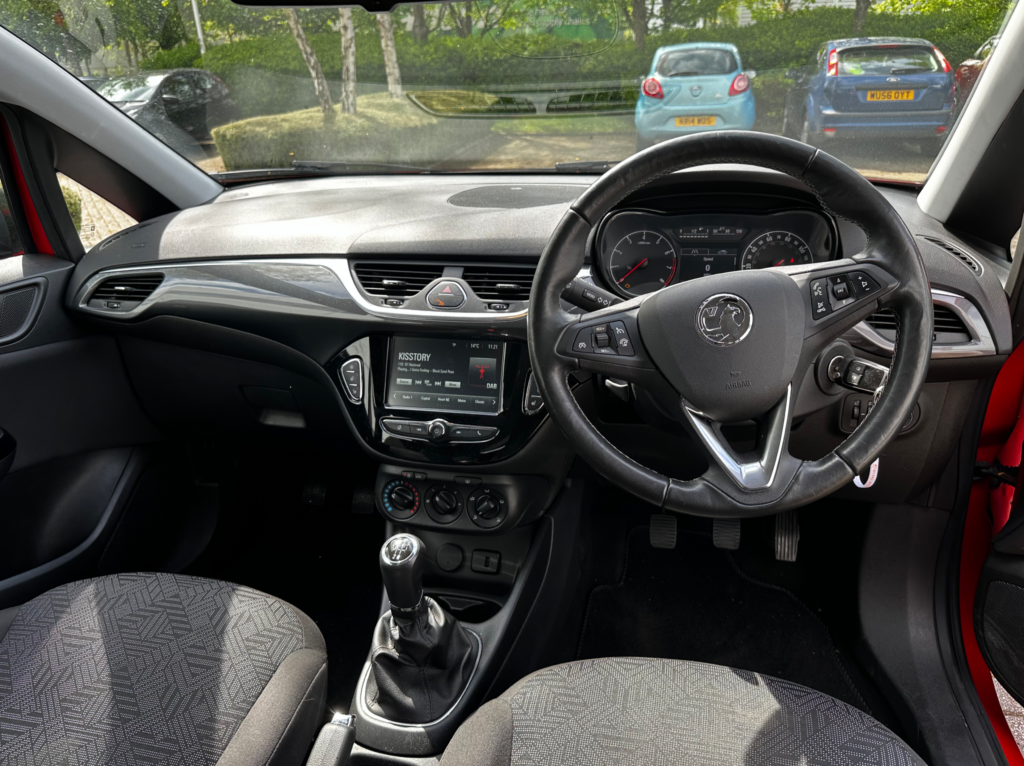 View of red Vauxhall Corsa's dashboard