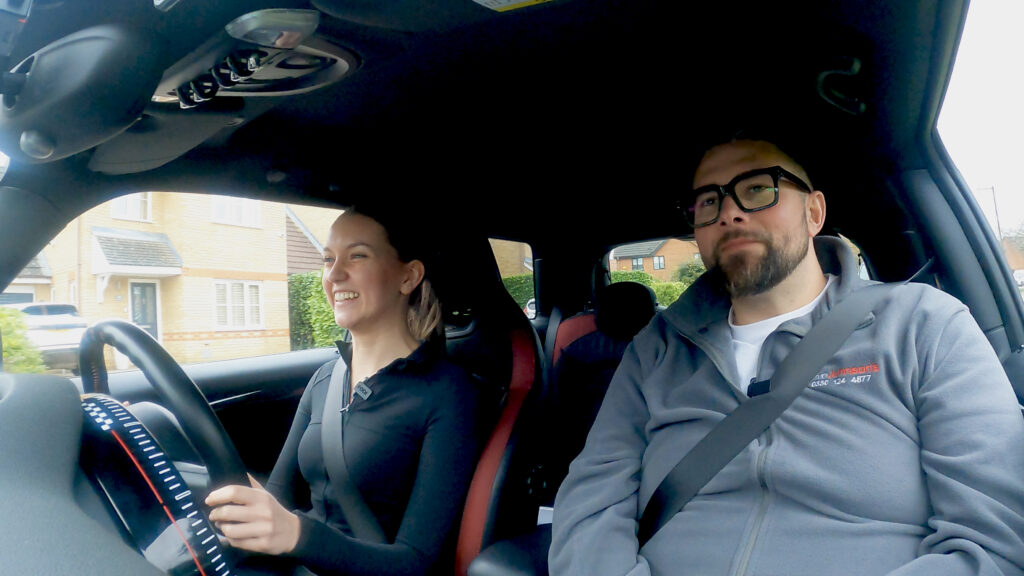 Learner and driving instructor in the car