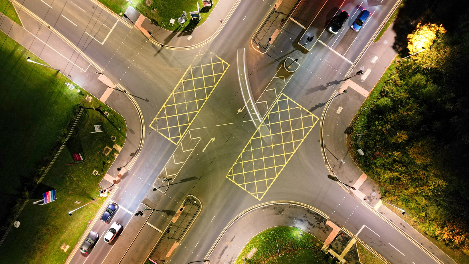 Yellow box crossroads at night