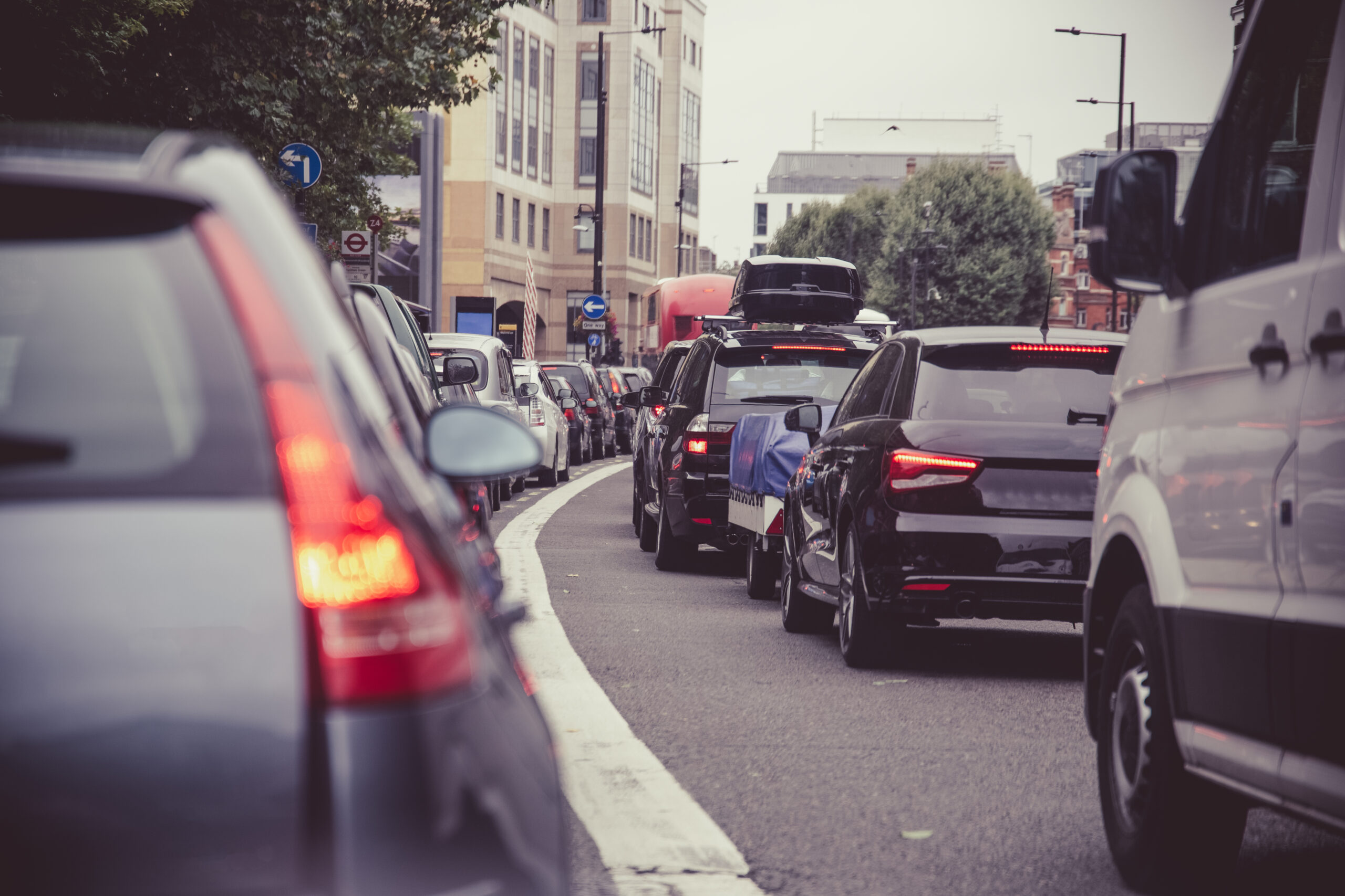 Queue of heavy traffic on a road in an urban area