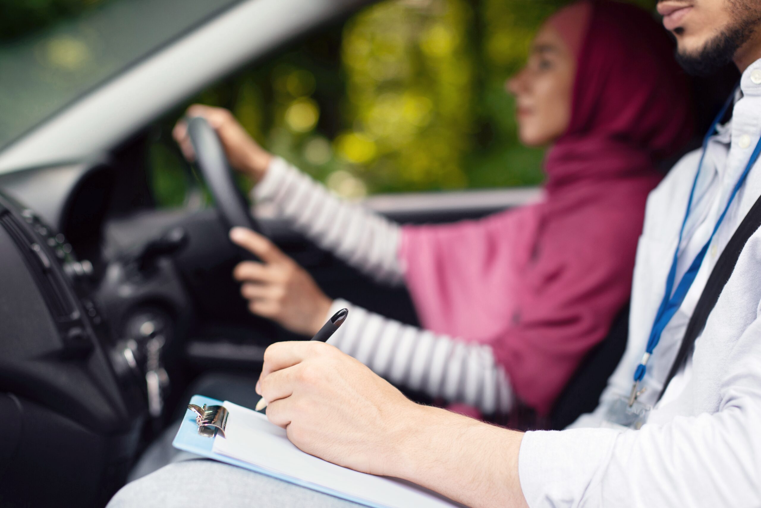 Woman on a driving test with examiner in the car