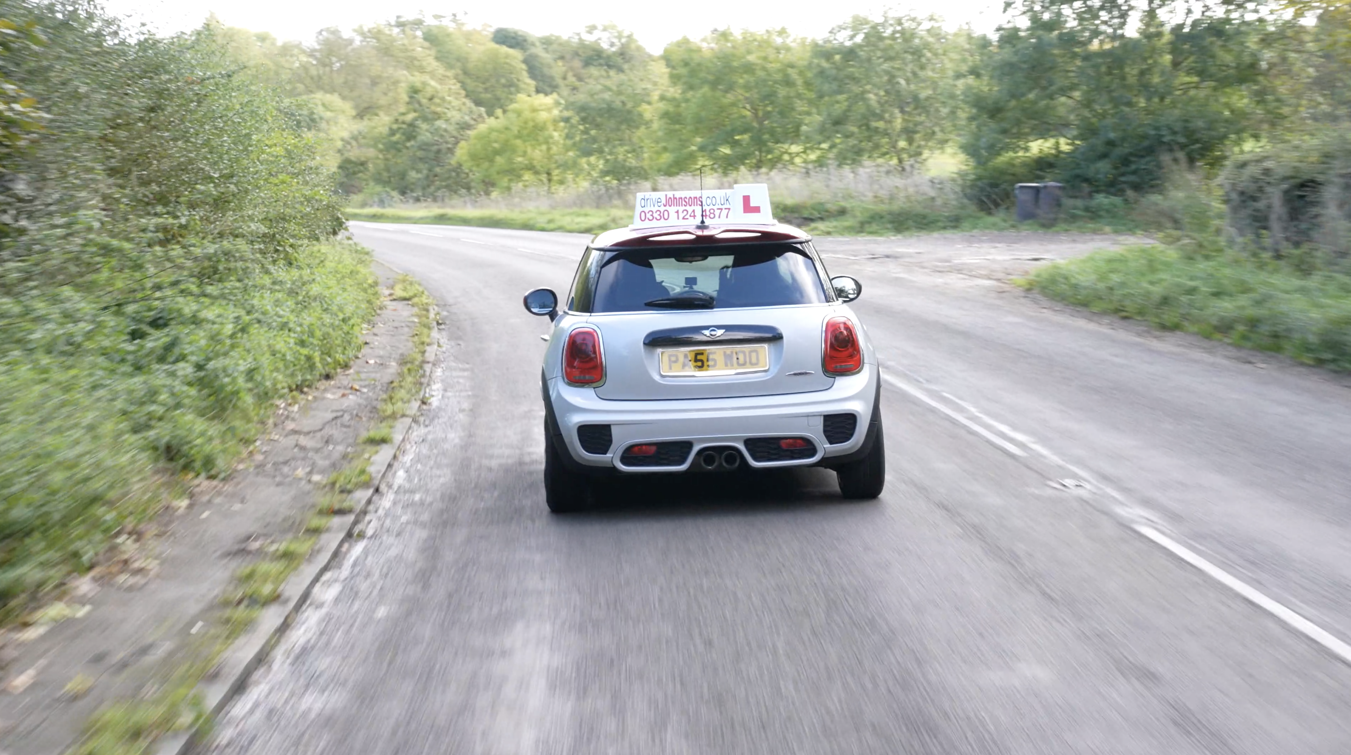 Mini driving on open road