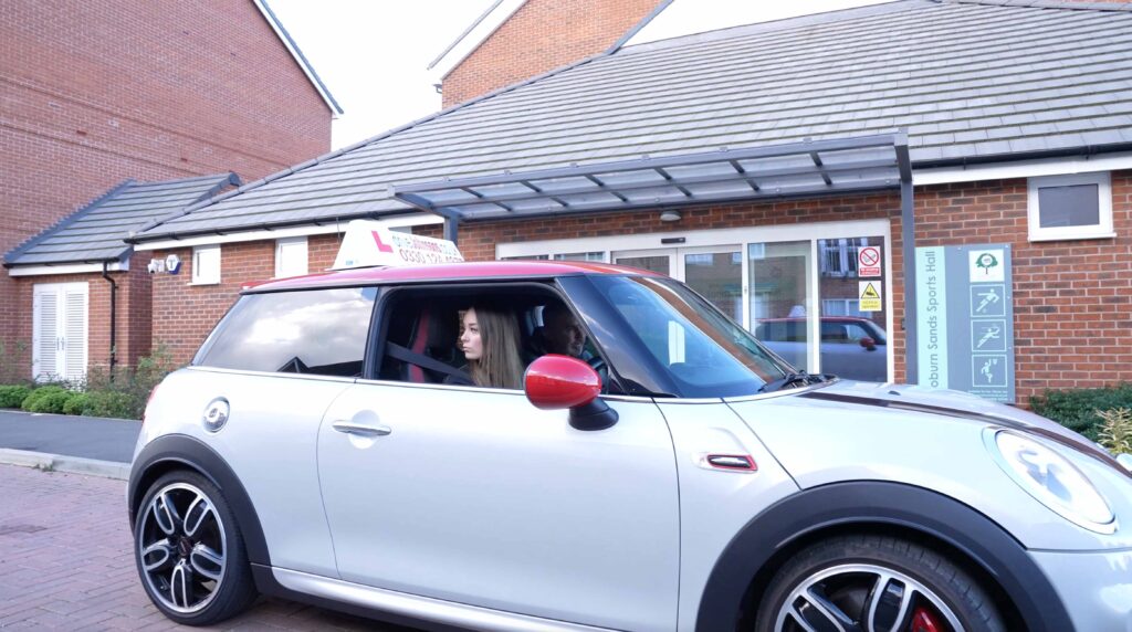 Learner in a driveJohnson's mini about to move off from the side of the road
