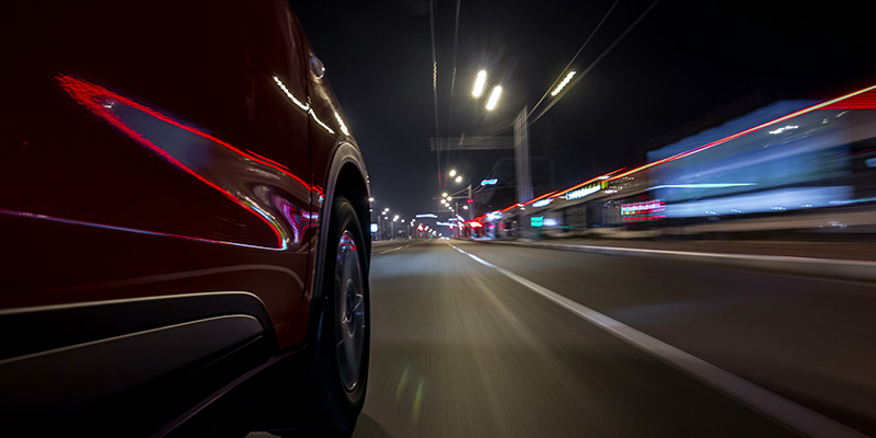 Car driving at speed on the road