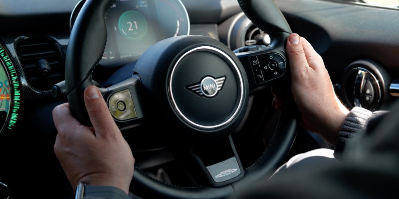 Both hands on mini steering wheel