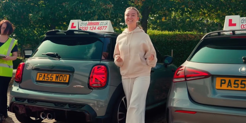 Learner smiling at the end of driving test