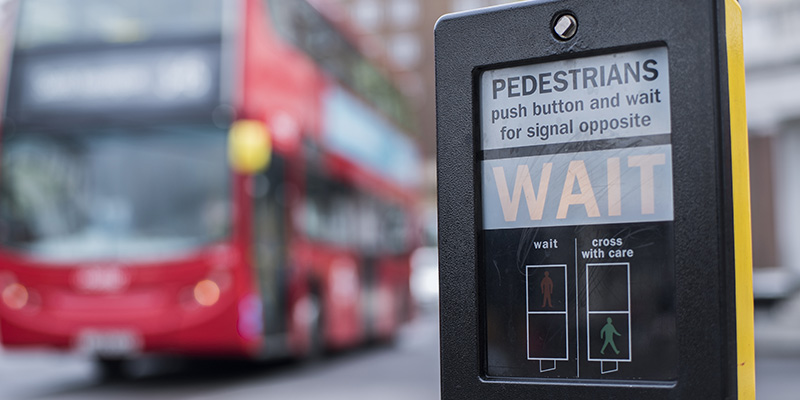 Pedestrian crossing yellow wait box with bus