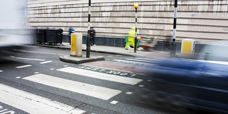 Zebra crossing with cars passing