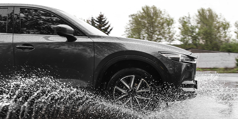 Car driving through standing water