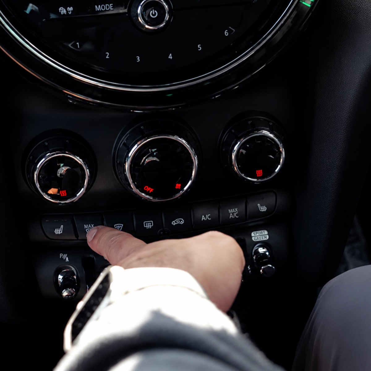 Front demister control in car