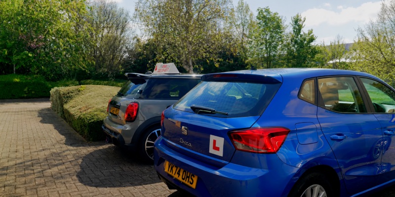 Two learner cars parked next to each other