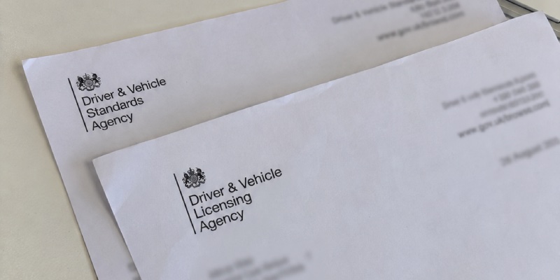 2 letters piled, one from the DVSA and one from the DVLA