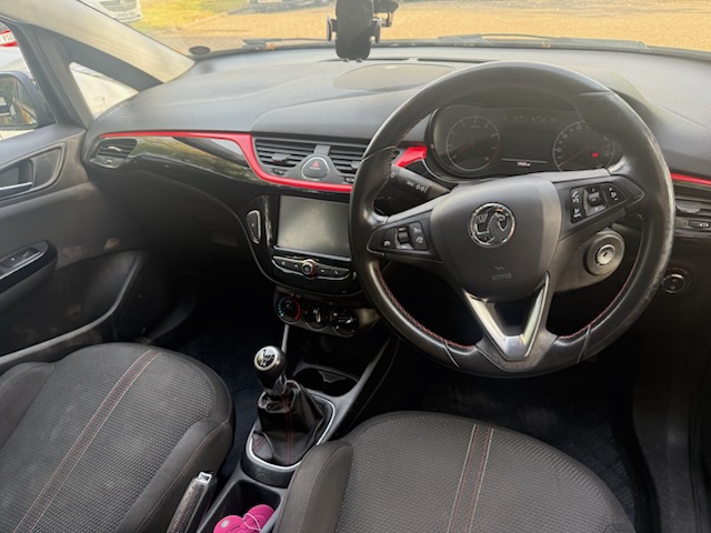 Inside view of black Vauxhall Corsa Sri VX-line 1.4L petrol car with dual controls for driving instructors