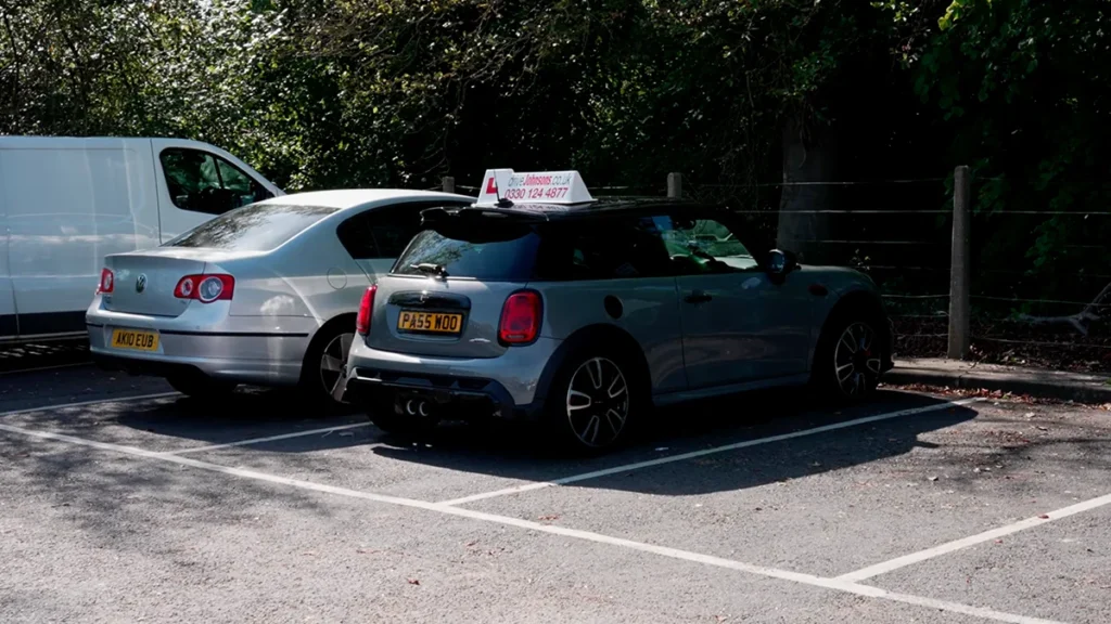 Mini cooper parked forwards in a bay