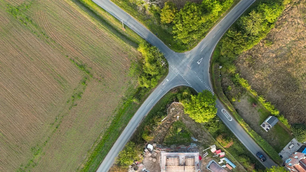 Aerial view of crossroads with fields around